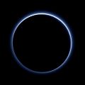 Blue hazes over backlit Pluto