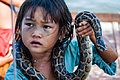 Tonle Sap Siem Reap Cambodia Girl-begging-for-money-with-snake-01