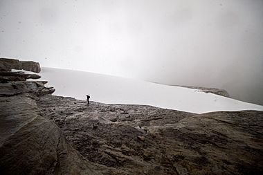 A hiker reaches the glacier atop Ritak U'wa Blanco