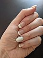 French Manicure with Glitter nail art on ring finger