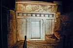 Facade of Philip 2 of Macedon tomb in Vergina, Greece. The door is made of marble and the order is doric.