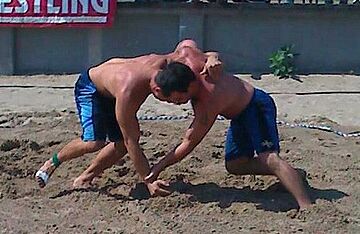 Anthony Gallton (left) vs Robert Teet (right) during USA Wrestling's 2010 World Team Trials for beach wrestling