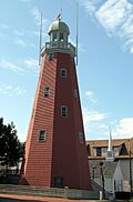 Portland Observatory in 2005, a tall, red, lighthouse-like structure with a windowed dome on top.