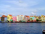 Waterfront with a series of brightly coloured houses