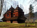Wooden church surrounded by trees