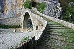 A stone bridge across dry stream