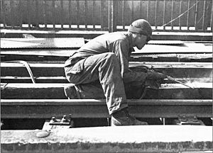 Welder repairing Ludendorff Bridge 1945