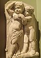 Fragment of a marble sarcophagus depicting two drunken boys from a Bacchic revel, made in Athens 140-150 CE MH
