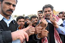 Iraqi voters inked fingers