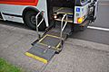 Wheelchair lift in a 1992 Flxible Metro bus lowered to sidewalk