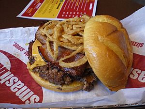 Smashburger BBQ bacon cheddar burger with deep-fried onions (1)