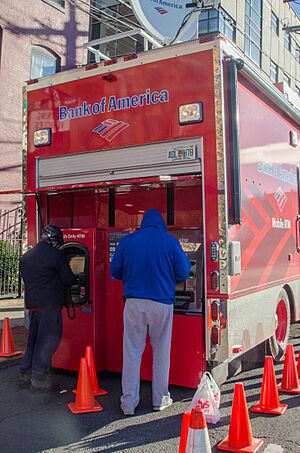 Hoboken, N.J., Nov. 3, 2012 -- Bank of America and other banks have set up mobile ATMs for survivors of Hurricane Sandy get cash to spend at stores that are open for cash customers. - DPLA - def08f331beecb7cc3210f2c013d1a7a