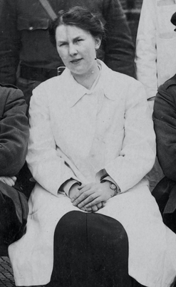 Black and white photograph of Dulcie Mary Pillers, seated front row, next to Ernest William Hey Groves (not shown). Taken from a group photograph of the medical staff at the hospital near the end of World War I.