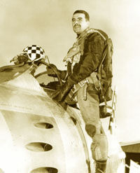 Buttelmann posing while climbing into the cockpit