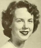 A yearbook photograph of a young smiling white woman in 1952.