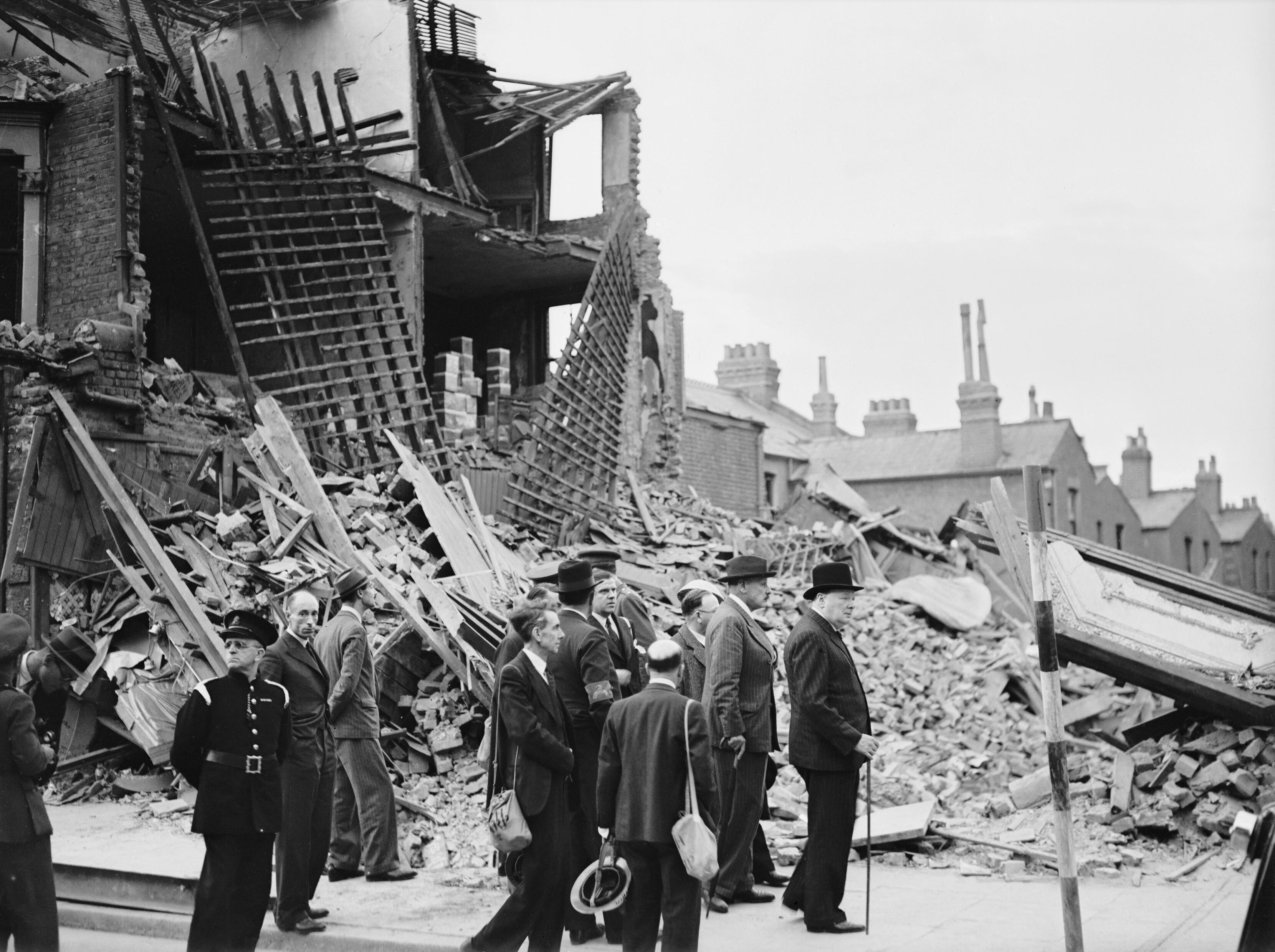 Image Winston Churchill visiting bombdamaged areas of the East End of