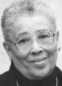 An older African-American woman with short grey hair, wearing glasses