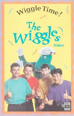 Cover showing four of The Wiggles doing their thumbs up with Dorothy the Dinosaur at the back holding her bag.