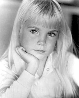 Young female child with blonde hair posed