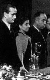 Irene Falcón flanked by Vicente Uribe and Planelles at a PCE meeting in Moscow, 1940.jpg