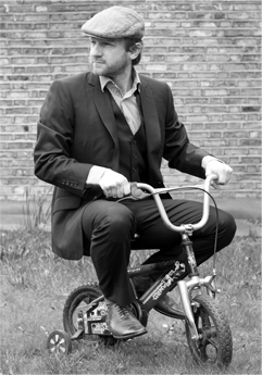 Author Illustrator Simon Basher on a tricycle.jpg
