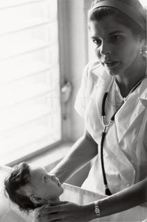 Helen-rodriguez-trias-taking-care-of-a-newborn