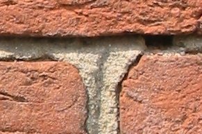 Three old bricks held together with mortar