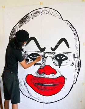 Artist Fahmi Reza creating artwork of Najib Razak