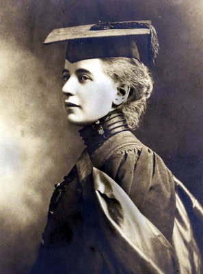 Black and white portrait graduation photograph of Elizabeth Ness MacBean Ross. She is wearing her graduation gown and cap, and looking to the left.