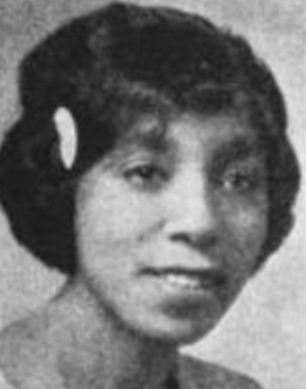 A photograph of a young African-American woman, wearing barrette or comb in her hair