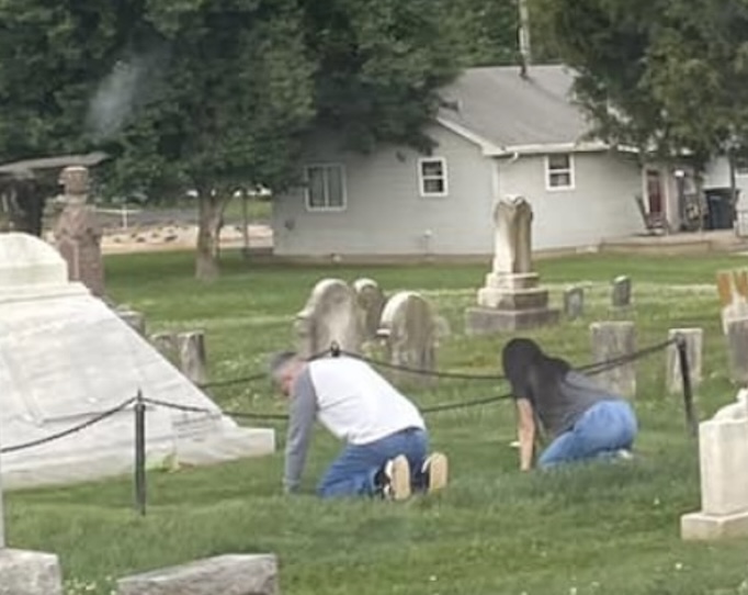 Worshippers bowing at the grave of William Branham