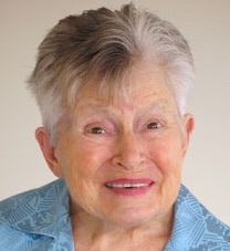 Older white woman with short grey hair, smiling.