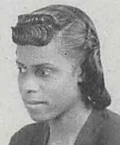 A yearbook photograph of a dark-skinned young woman with chin-length hair and sculpted bangs
