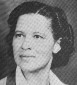 A young light-skinned African-American woman; her hair is cropped to chin length and side-parted. She is wearing a wide-collared shirt.