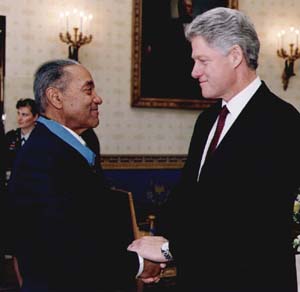 Clinton congratulates Medal of Honor recipient Vernon Baker
