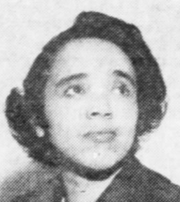 A young African-American woman with coiffed hair, looking upward