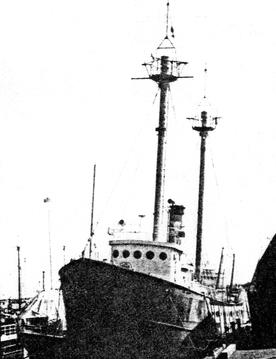 Port bow quarter photograph of Lightship 114 at a dock c.1990