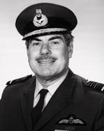 Head-and-shoulders portrait of mustachioed man in dark military uniform with peaked cap