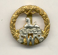 South Wales Borderers cap badge, showing the Sphinx.jpg