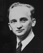 Black-and-white photograph of Ferencz, aged 27, wearing a black pinstriped suit and a dark tie