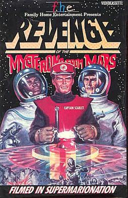 A man wearing a red uniform prepares to pick up a shining crystal with his gloved hands. He is flanked by two men in spacesuits, both holding guns. Against a starfield background, the text of the poster reads: "Family Home Entertainment presents – Revenge of the Mysterons from Mars – Filmed in Supermarionation".