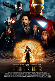 Tony Stark is pictured center wearing a smart suit, against a black background, behind him are the Iron Man red and gold armor, and the Iron Man silver armor. His friends, Rhodes, Pepper, are beside him and below against a fireball appears Ivan Vanko armed with his energy whip weapons.