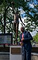 Erving standing next to his statue at UMass unveiling ceremony, Sep 10 2021