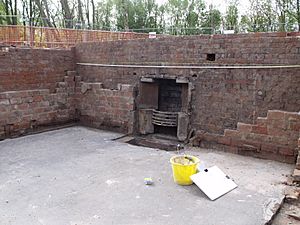 Excavated cellar chamber and fire place, Worsley New Hall