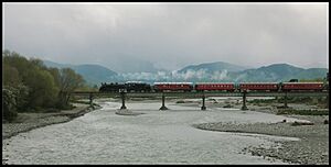Excursion, a steam locomotive crosses the Waingawa River in 2017