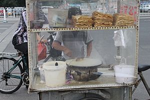 Jianbing being prepared by a street vendor