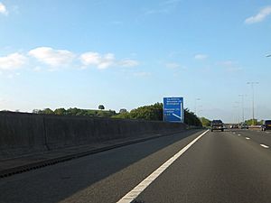 Parapet of M5 railway bridge and signs for Junction 7 (geograph 3480917)
