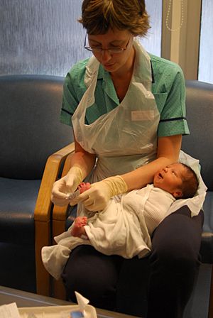 British woman tending to a baby.jpg
