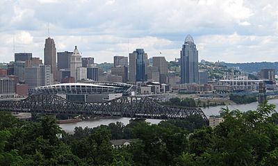 The WKRQ Tower as seen in relation to the Cincinnati Skyline, it is the lattice tower on the left hand side of the image north of the downtown core