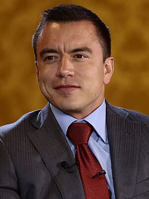 Headshot of Daniel Noboa. He is a clean-shaven, Latino man with very short hair, wearing a suit with a tie.